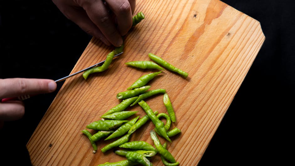 person prepping healthy dinner in kitchen evening natural light