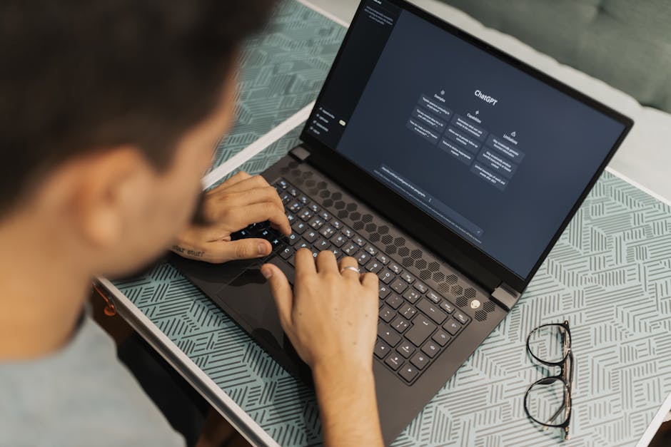 pexels-16094046 office worker using AI chatbot on laptop cybersecurity governance