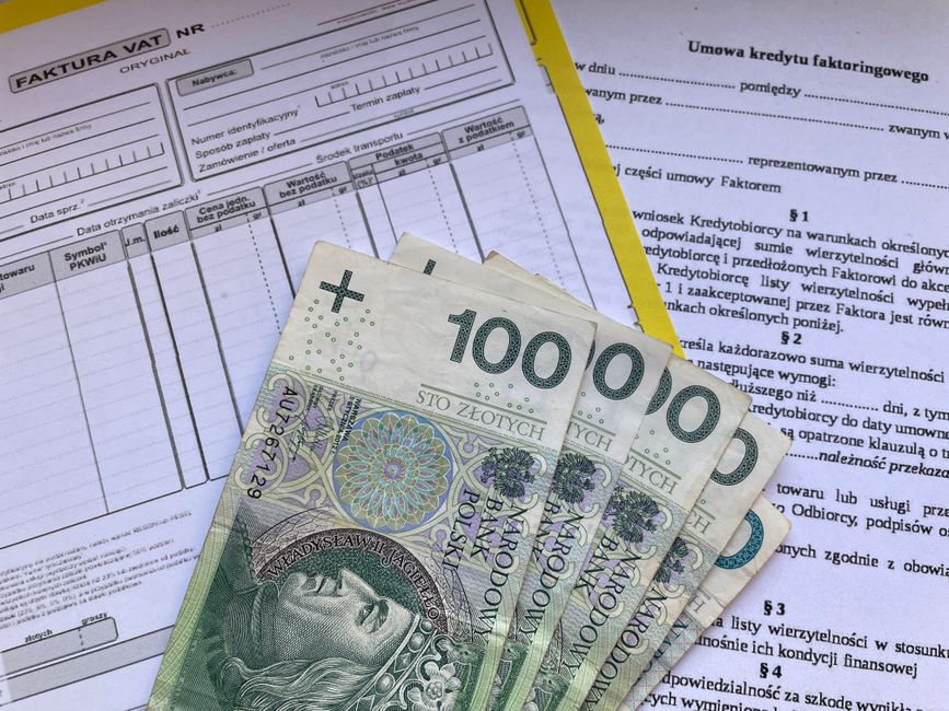 small business owner reviewing financing options cash flow dashboard invoice factoring revenue based financing SaaS lending