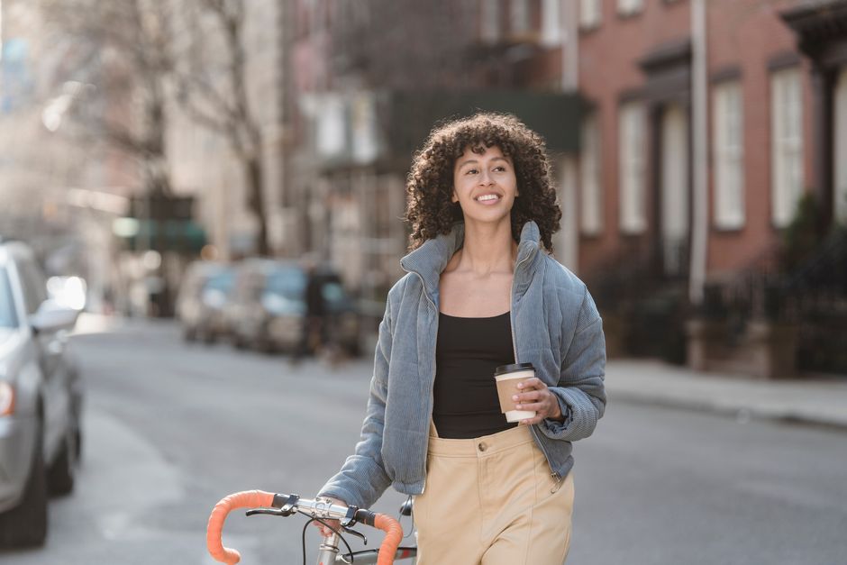 pexels-7242955 person drinking coffee outside morning sunlight walk