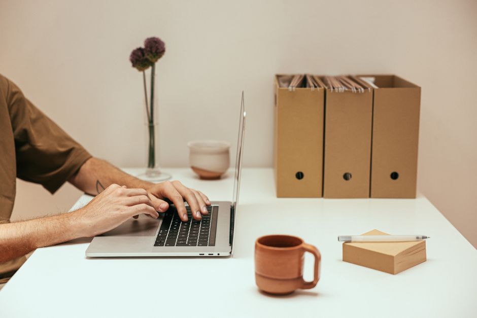 pexels-8473781 person organizing files on laptop cloud storage cleanup concept