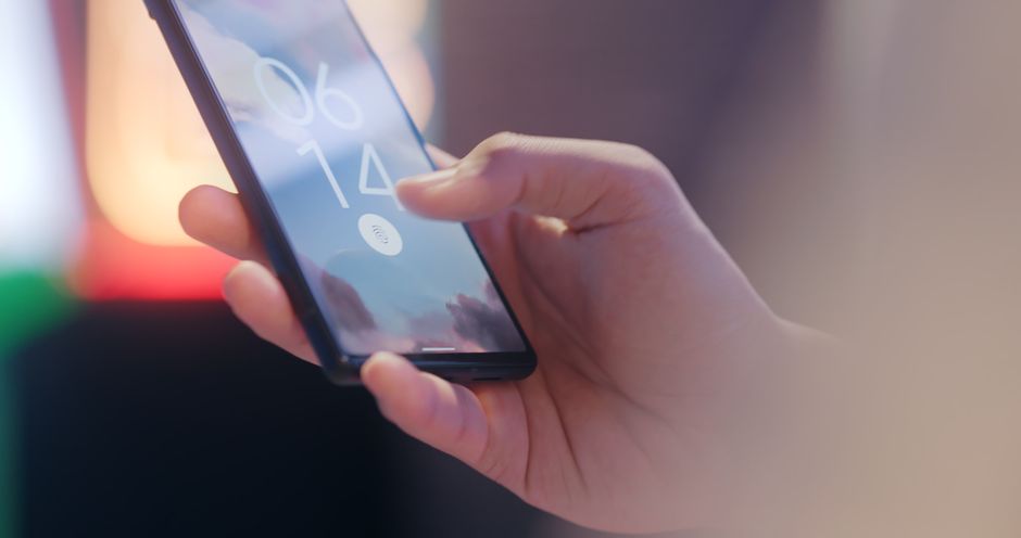 person using smartphone biometric login passkey authentication