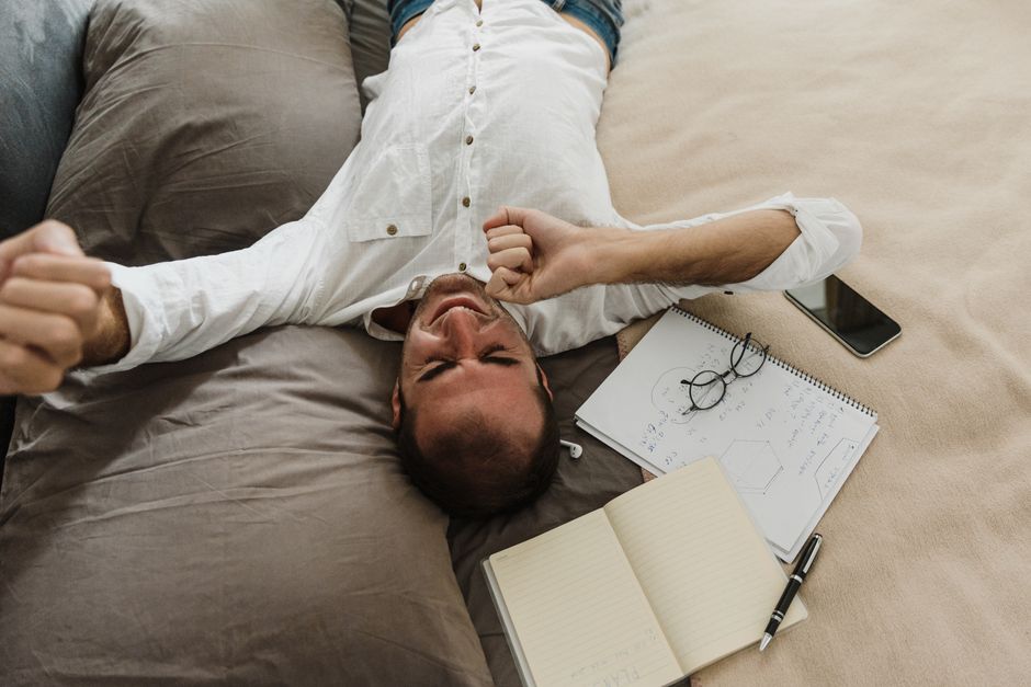person stretching at desk home office movement break