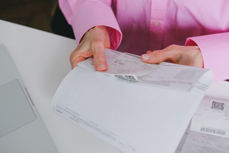 pexels-7545333 small business owner reviewing invoices cash flow late payments desk
