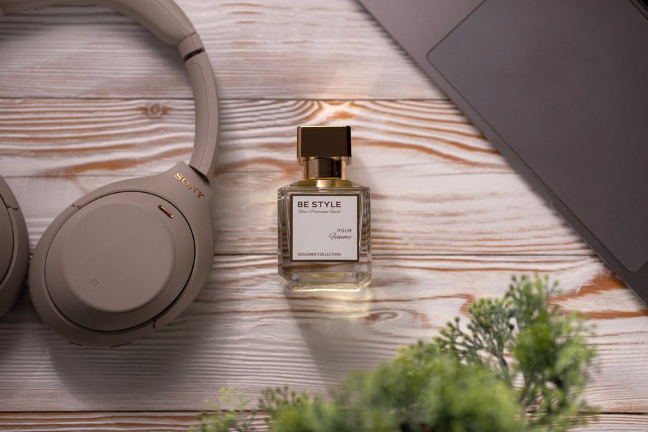 headphones perfume bottle lifestyle desk night out