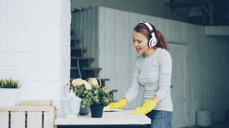 pexels-36715260 person cleaning apartment listening to music headphones sunday reset