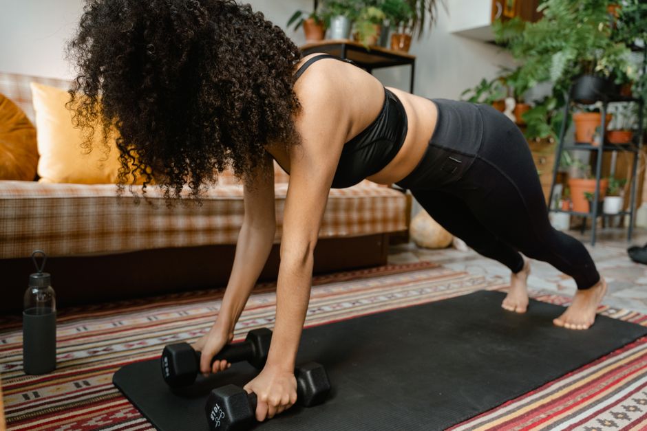 person doing short home workout in living room with timer and stairs